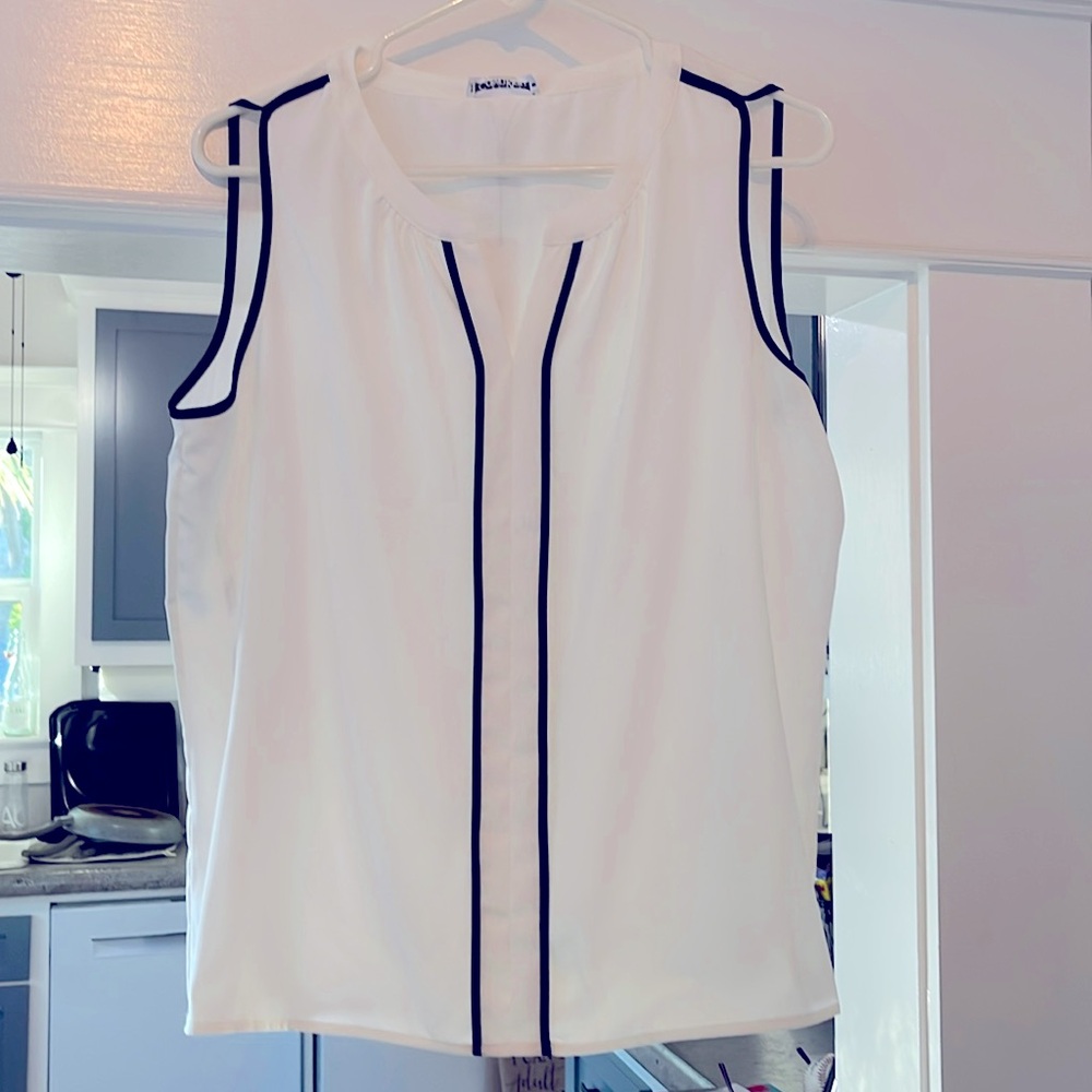 White with black piping. Calvin Klein blouse. Size L. NWT